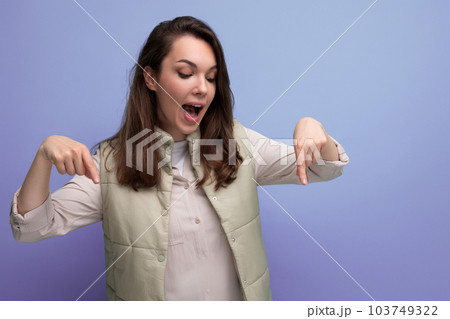 well-groomed emotional woman inspired by an idea on a blue background with copy space 103749322