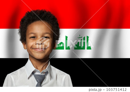 Iraqi kid boy on flag of Iraq background. Education and childhood concept 103751412