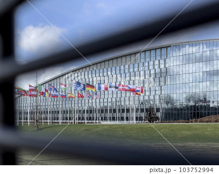 Brussels, Belgium - February 19, 2022: NATO Headquarters, political and administrative centre of the Alliance Brussels, Belgium - February 19, 2022: NATO Headquarters, political and administrative centre of the Alliance 103752994