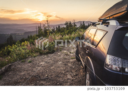 car for traveling with a mountain road 103753109