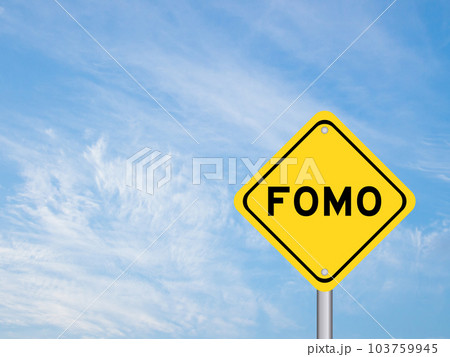 Yellow transportation sign with word FOMO (abbreviation of fear of missing out) on blue color sky background 103759945