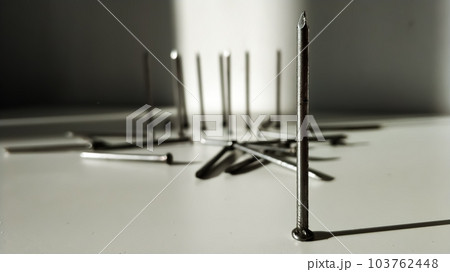 One hobnail in the foreground close-up. Company leader. Outcast in society. One hobnail in the foreground close-up. Company leader. Outcast in society. 103762448