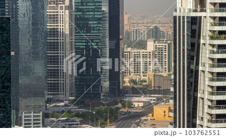 Tall residential buildings at JLT aerial timelapse, part of the Dubai multi commodities centre mixed-use district. Tall residential buildings at JLT aerial timelapse, part of the Dubai multi commodities centre mixed-use district. 103762551