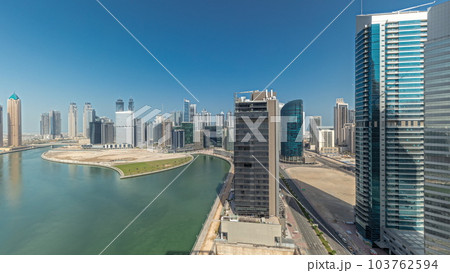 Cityscape skyscrapers of Dubai Business Bay with water canal aerial timelapse. 103762594