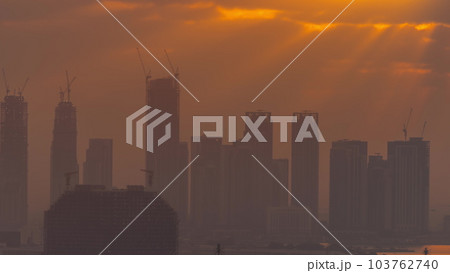 Sunrise over Dubai Creek Harbor with skyscrapers and towers under construction aerial timelapse Sunrise over Dubai Creek Harbor with skyscrapers and towers under construction aerial timelapse 103762740