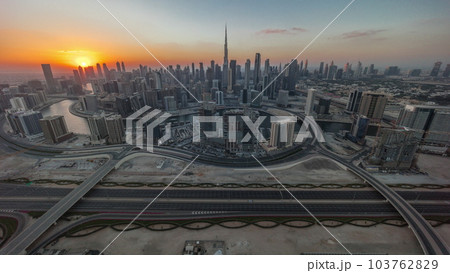 Sunset over panoramic skyline of Dubai with business bay and downtown district timelapse. 103762829