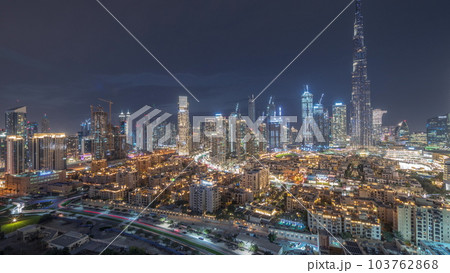 Dubai Downtown day to night transition timelapse with tallest skyscraper and other towers 103762868