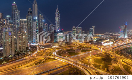 Dubai Marina highway intersection spaghetti junction day to night timelapse 103762902