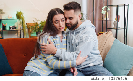Compassion in family, man supporting depressed offended woman of bad pregnancy test results, quarrel Compassion in family, man supporting depressed offended woman of bad pregnancy test results, quarrel 103764263