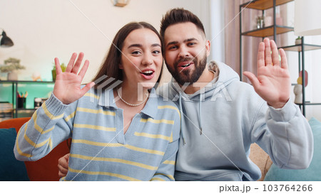 POV family man woman at home looking at camera, making video conference call with friends or family 103764266