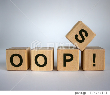 Oops sign on wooden cubes. Beautiful white background, copy space. Concept. Oops sign on wooden cubes. Beautiful white background, copy space. Concept. 103767181
