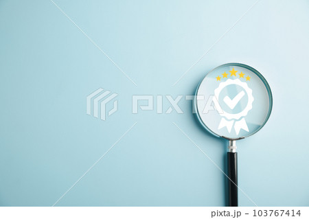 Magnifying glass reveals an aligned icon, symbolizing quality assurance certificate. Emphasizing the importance of certification and ISO quality concept for confidence in good service. 103767414