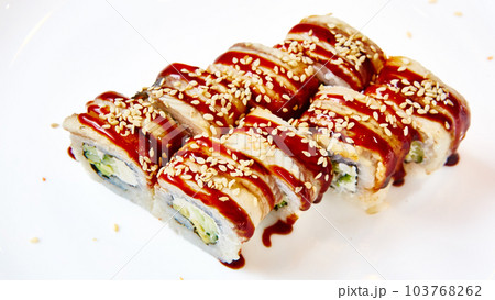 Unagi Sushi rolls. Sushi with eel, cream cheese and avocado, sprinkled with white and black sesame seeds 103768262