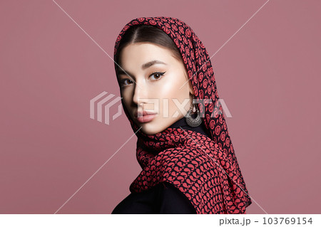 beautiful young woman in veil and jewelry. beauty girl in color hijab 103769154