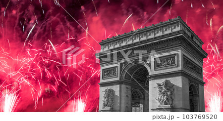 Celebratory colorful fireworks over the Arc de Triomphe, Paris, France. The walls of the arch are engraved with the names of 128 battles and names of 660 French military leaders (in French) Celebratory colorful fireworks over the Arc de Triomphe, Paris, France. The walls of the arch are engraved with the names of 128 battles and names of 660 French military leaders (in French) 103769520