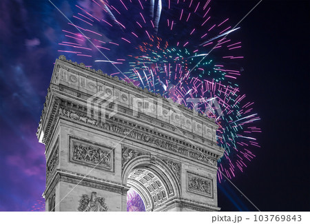 Celebratory colorful fireworks over the Arc de Triomphe, Paris, France 103769843