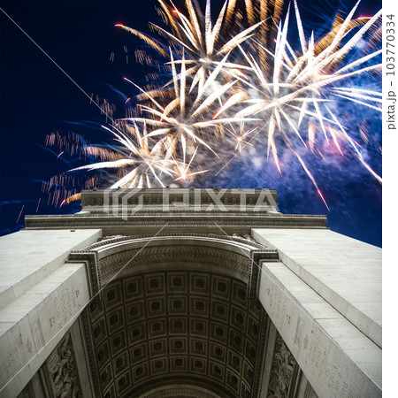 Celebratory colorful fireworks over the Arc de Triomphe, Paris, France 103770334