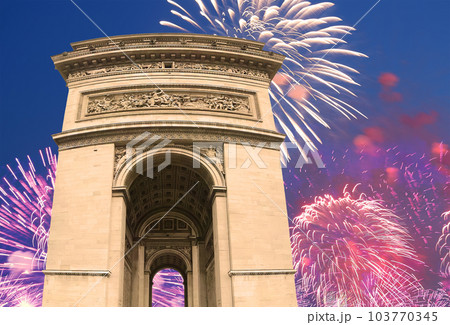 Celebratory colorful fireworks over the Arc de Triomphe, Paris, France 103770345