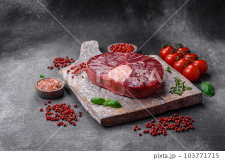 Fresh beef ossobuco steak with salt, spices and herbs 103771715