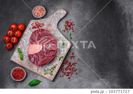 Fresh beef ossobuco steak with salt, spices and herbs Fresh beef ossobuco steak with salt, spices and herbs 103771727