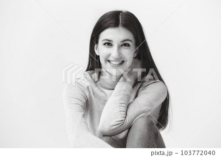 black and white portrait of a beautiful caucasian woman, looking at camera, happy and smiling black and white portrait of a beautiful caucasian woman, looking at camera, happy and smiling 103772040