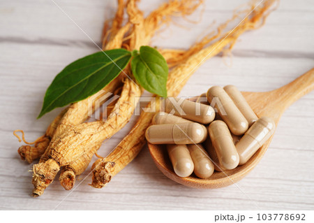 Ginseng roots and green leaf, healthy food. Ginseng roots and green leaf, healthy food. 103778692