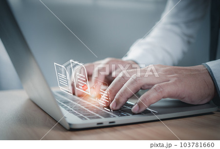Businessman using a computer to complete Individual income tax return form online for tax payment. financial research, report. Calculation tax return. 103781660