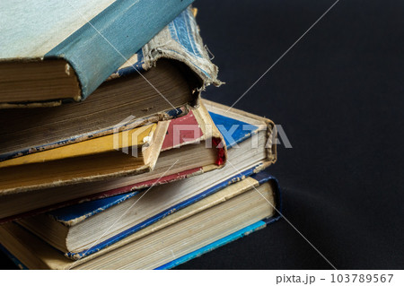 Book background. Stack of books in the library. Old yellow pages of paper books. Learning and knowledge Book background. Stack of books in the library. Old yellow pages of paper books. Learning and knowledge 103789567
