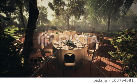 Serene outdoor dining spot on a tree-lined street 103794691