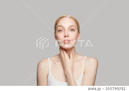 Portrait of pretty cheerful woman with clear skin, studio headshot photo. Facial treatment 103799282