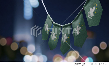 A garland of Macao national flags on an abstract blurred background 103801339