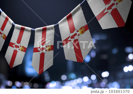 A garland of Northern Ireland national flags on an abstract blurred background A garland of Northern Ireland national flags on an abstract blurred background 103801370