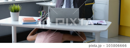 Satisfied male boss at desktop and woman molest under table Satisfied male boss at desktop and woman molest under table 103806666