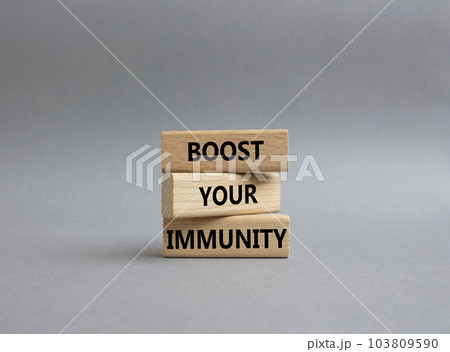 Boost your immunity symbol. Concept word Boost your immunity on wooden blocks. Beautiful grey background. Helthcare and Boost your immunity concept. Copy space Boost your immunity symbol. Concept word Boost your immunity on wooden blocks. Beautiful grey background. Helthcare and Boost your immunity concept. Copy space 103809590