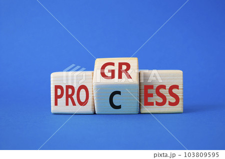 Process and Progress symbol. Wooden cubes with words Process and Progress. Beautiful blue background. Business and Process and Progress concept. Copy space 103809595