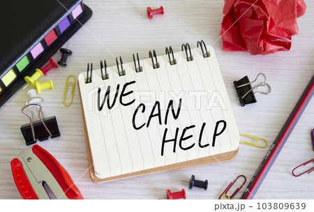We can help symbol. Concept words We can help on white notebook. Beautiful wooden background. Business and We can help concept. Copy space. 103809639