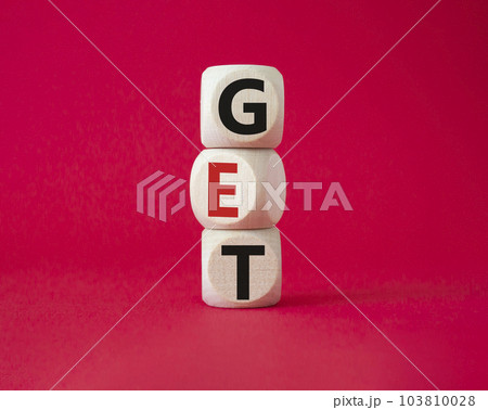 GET symbol. Concept word GET on wooden cubes. Beautiful red background. Business and GET concept. Copy space. 103810028