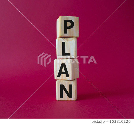 Plan symbol. Concept word Plan on wooden cubes. Beautiful red background. Business and Plan concept. Copy space. Plan symbol. Concept word Plan on wooden cubes. Beautiful red background. Business and Plan concept. Copy space. 103810126