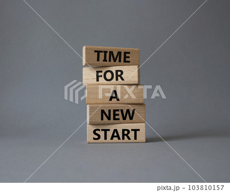 Time for a new start symbol. Wooden blocks with words Time for a new start. Beautiful grey background. Business and Time for a new start concept. Copy space. 103810157