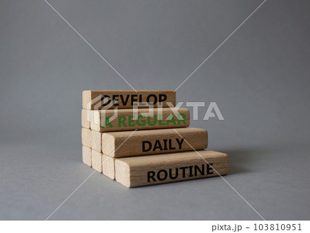 Develop a regular daily routine symbol. Concept words Develop a regular daily routine on wooden blocks. Beautiful grey background. Business and concept. Copy space. Develop a regular daily routine symbol. Concept words Develop a regular daily routine on wooden blocks. Beautiful grey background. Business and concept. Copy space. 103810951