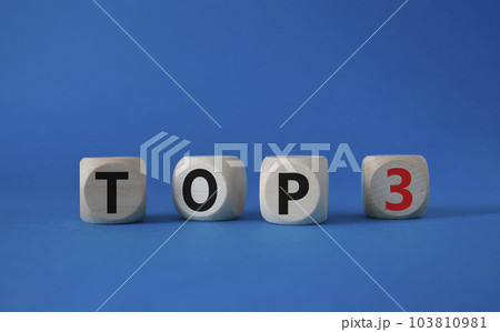 Top 3 symbol. Concept word Top 3 on wooden cubes. Beautiful blue background. Business and Top 3 concept. Copy space. Top 3 symbol. Concept word Top 3 on wooden cubes. Beautiful blue background. Business and Top 3 concept. Copy space. 103810981