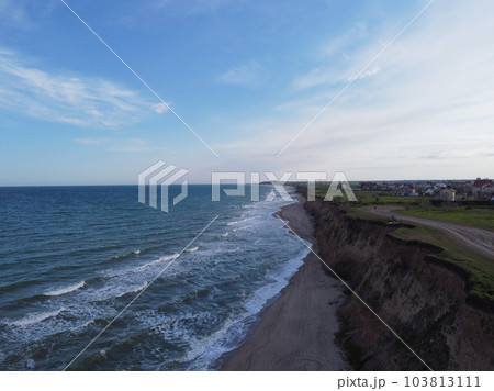 Empty sunny summer sand beach with clear sea water. Empty sunny summer sand beach with clear sea water. 103813111