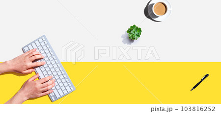 Woman using a computer keyboard 103816252