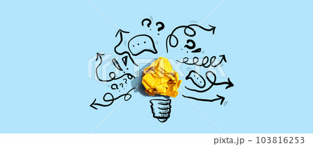 Brainstorming concept with a crumpled paper light bulb 103816253