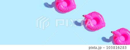 Summer concept with pink flamingo floats 103816283