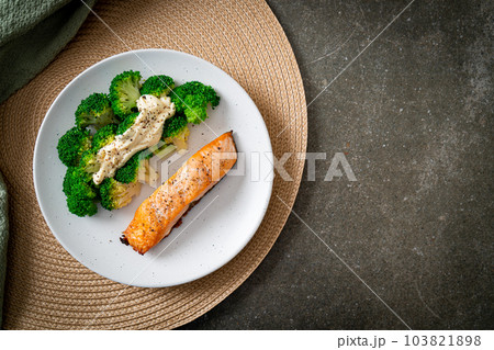 grilled salmon fillet steak with broccoli 103821898