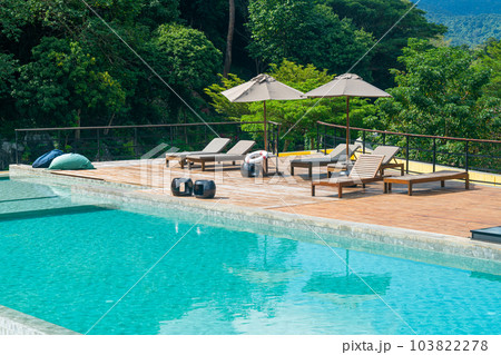 bed pool with umbrella around swimming pool bed pool with umbrella around swimming pool 103822278