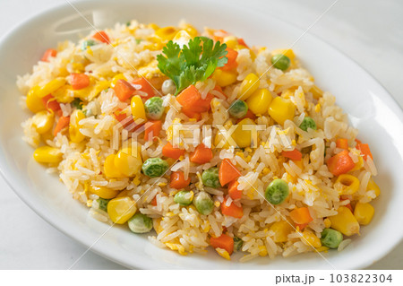 fried rice with mixed vegetable (carrot, green bean peas, corn) and egg fried rice with mixed vegetable (carrot, green bean peas, corn) and egg 103822304