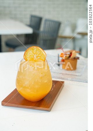 orange juice with soda on table 103822564
