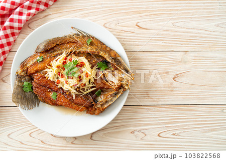 Fried Sea Bass Fish with Fish Sauce and Spicy Salad Fried Sea Bass Fish with Fish Sauce and Spicy Salad 103822568